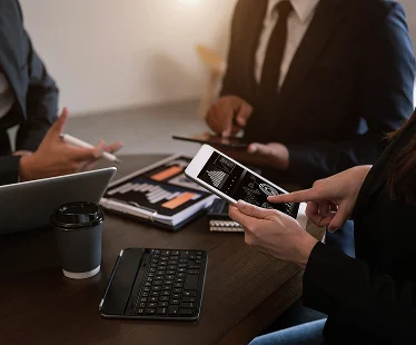 business-documents-office-table-with-smart-phone-calculator-digital-tablet-graph-business-with-social-network-diagram-two-colleagues-discussing-data-working-office 1