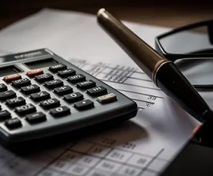 calculator-glasses-sit-top-piece-paper 1
