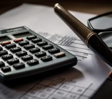 calculator-glasses-sit-top-piece-paper 1