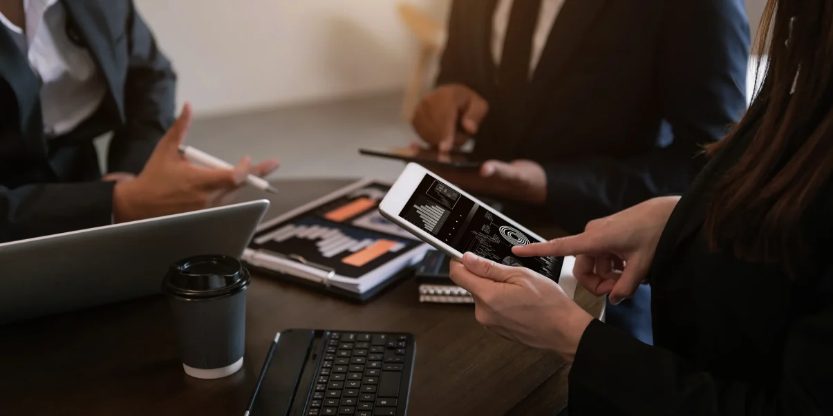 business-documents-office-table-with-smart-phone-calculator-digital-tablet-graph-business-with-social-network-diagram-two-colleagues-discussing-data-working-office 1